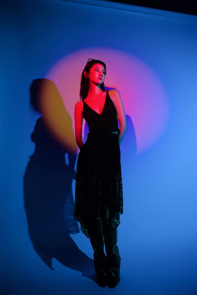 Studio portrait under blue and pink light